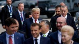 US President Donald Trump (L) and Turkey's President Recep Tayyip Erdogan (R) follow other leaders to a family photo during the NATO (North Atlantic Treaty Organization) summit at the NATO headquarters in Brussels on July 11, 2018. Brendan Smialowski/AFP/Getty Images