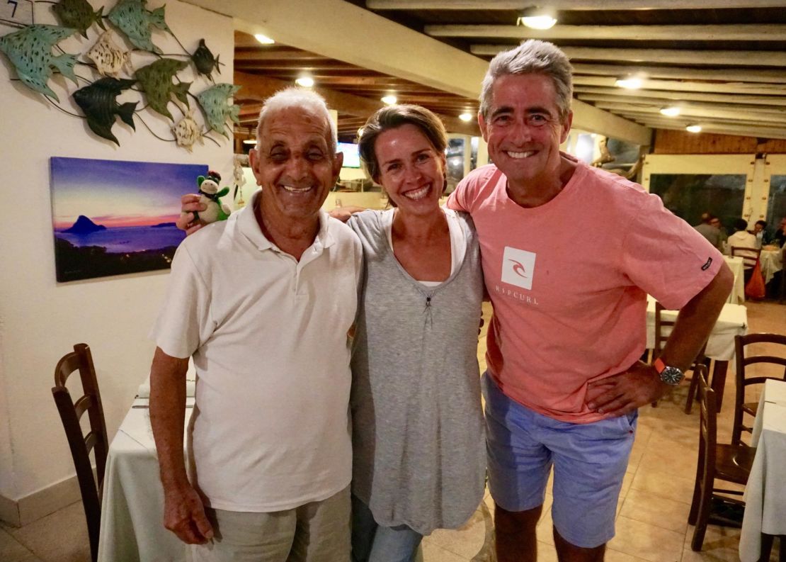 Tonino delights in welcoming patrons to his restaurant on Tavolara. Pictured is Tonino, Kellie Pollock and her husband, Jonathan Pollock.
