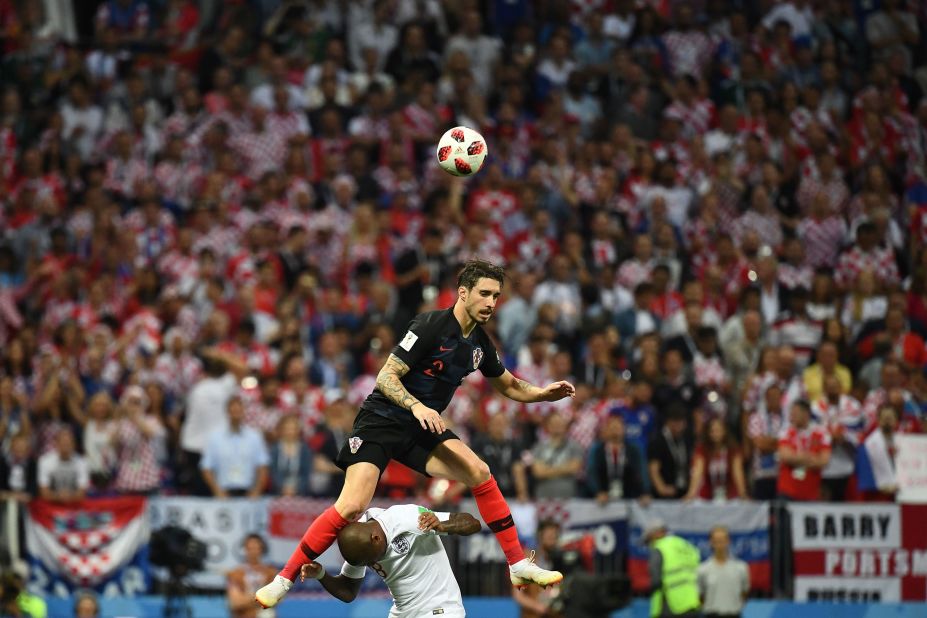 Croatian defender Sime Vrsaljko goes over Ashley Young for a header.