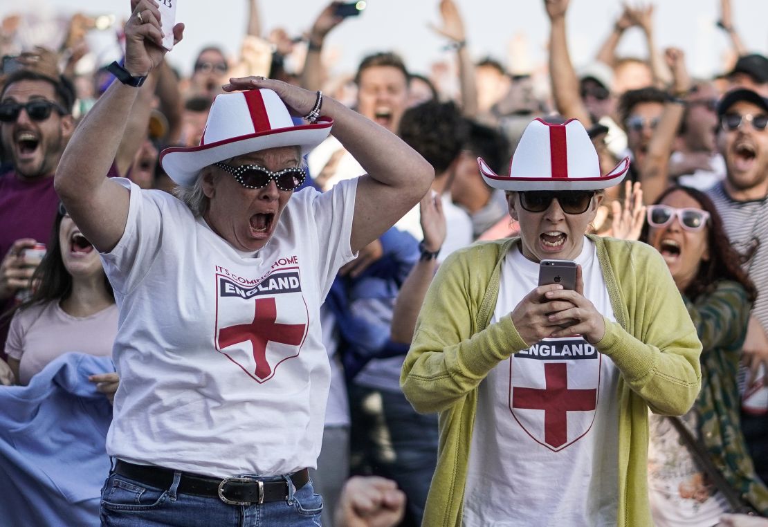 England fans celebrate their team's first goal in the city of Brighton.