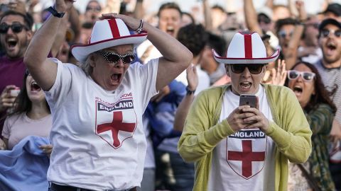 England fans celebrate their team's first goal in the city of Brighton.