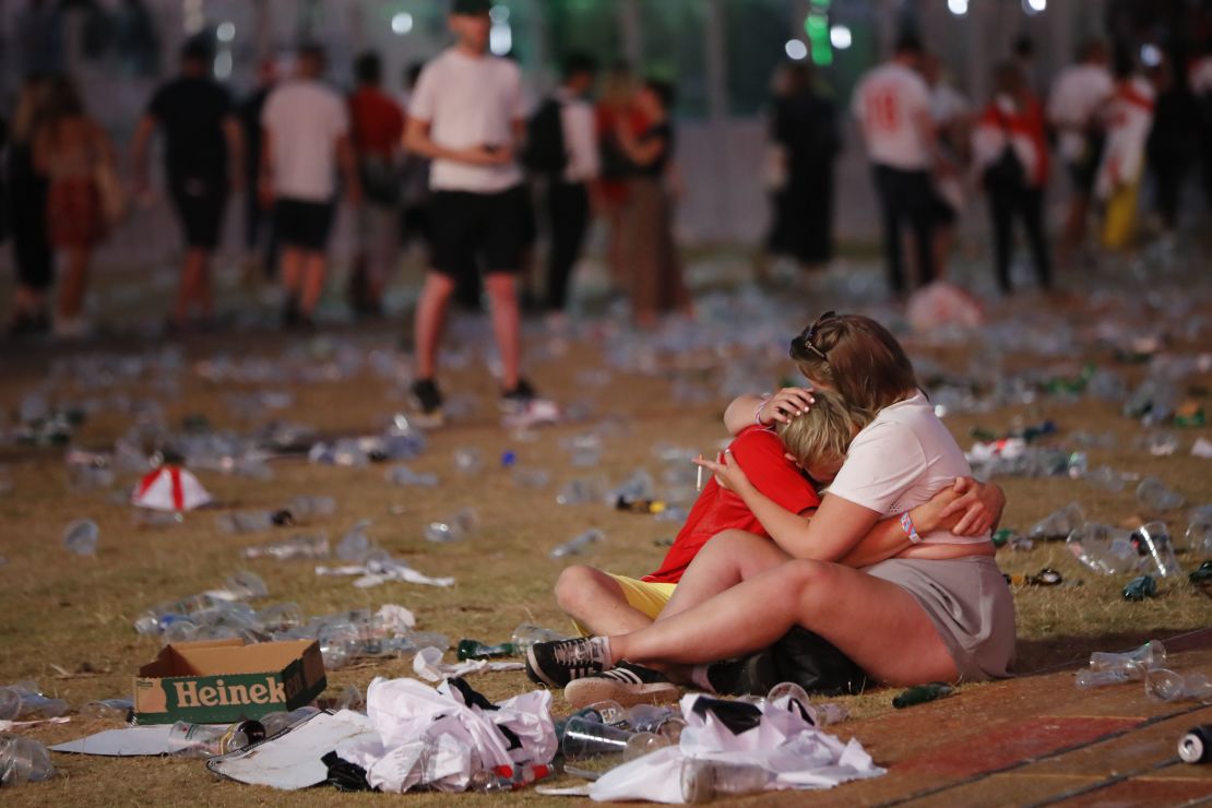 England supporters console each other at Hyde Park