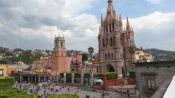 Tourists are seen on the main square in front of the San Miguel Arcangel cathedral on April 11, 2017 in San Miguel de Allende, Guanajuato state, Mexico. 
San Miguel De Allende, a town with Spanish Colonial architecture located in eastern Mexico, received a Travel + Leisures 2017 award as one of the World's Best Cities. / AFP PHOTO / YURI CORTEZ        (Photo credit should read YURI CORTEZ/AFP/Getty Images)