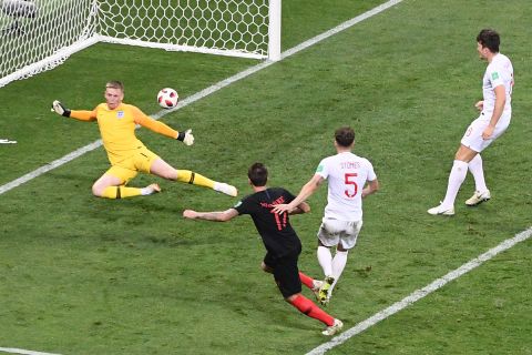 Mario Mandzukic scores against England late in extra time to give Croatia a 2-1 victory in the semifinals on Wednesday, July 11.