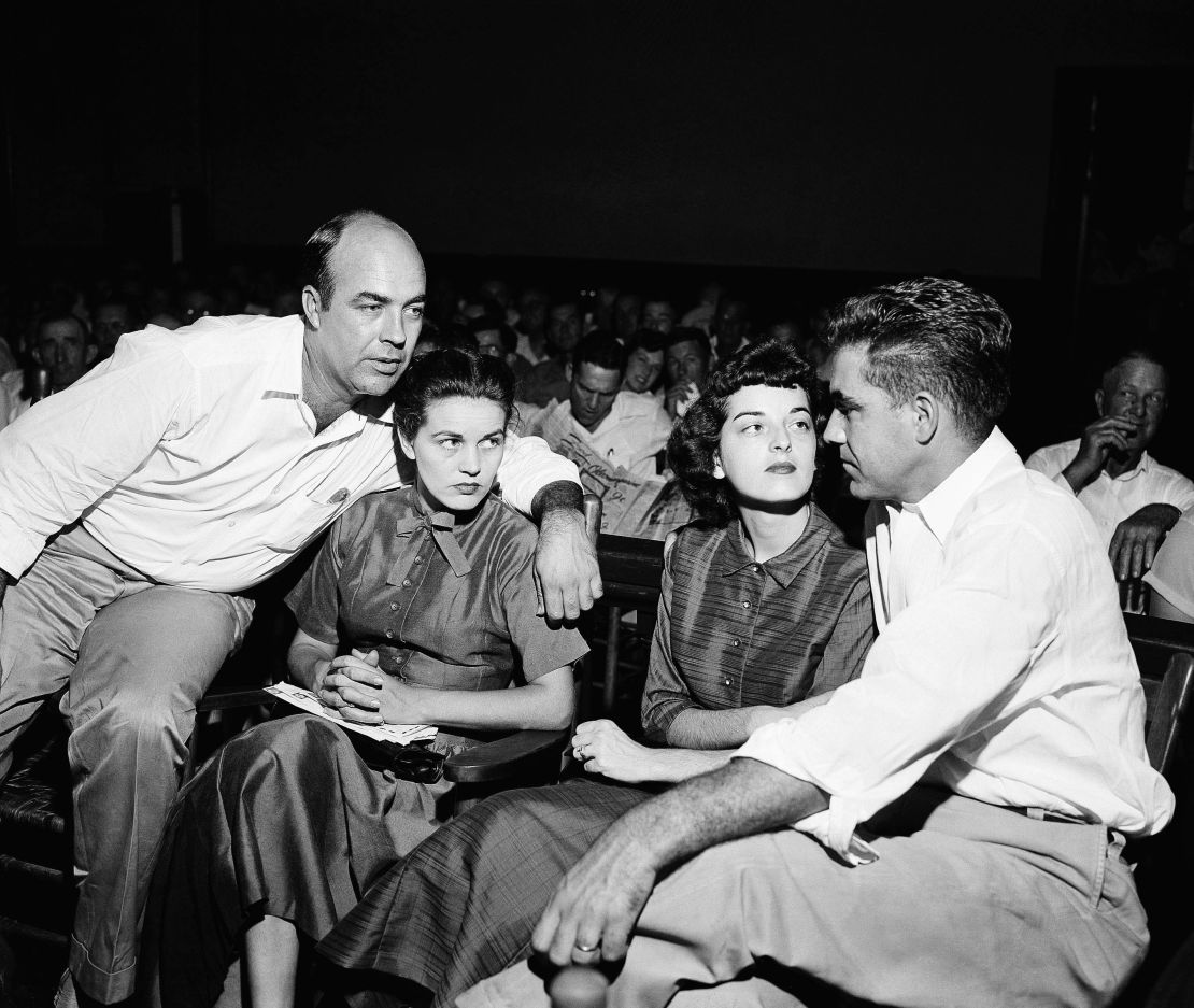 In this September 1955 photo, J.W. Milam, left, and Roy Bryant, right, sit with their wives, Juanita and Carolyn, in a Sumner, Mississippi, courtroom.