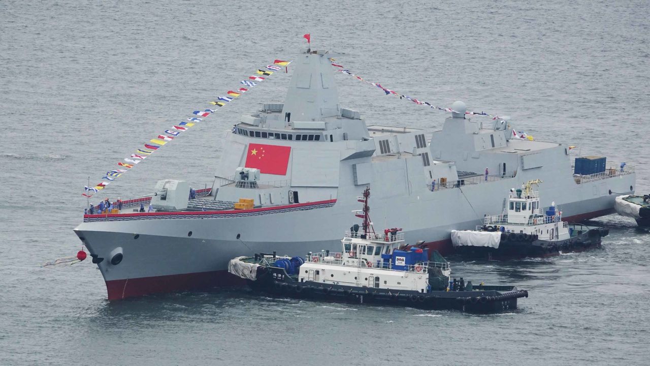 One of the two Type 055 guided-missile destroyers takes water at a shipyard in Dailan.
