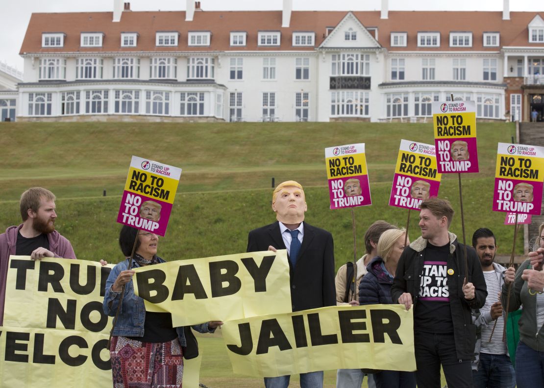 Activists from Stand Up to Racism Scotland (SUTR) stage a protest at the Trump Turnberry resort ahead of the US president's arrival in the UK.