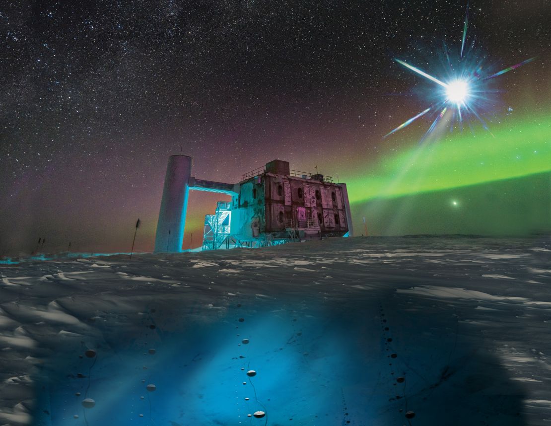 In this artistic rendering, based on a real image of the IceCube Lab at the South Pole, a distant source emits neutrinos that are detected below the ice by IceCube sensors.