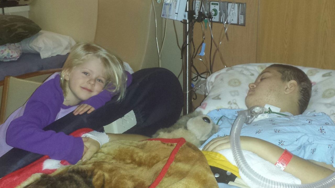 Alyssa Gilderhus with her younger sister resting at the Mayo Clinic.