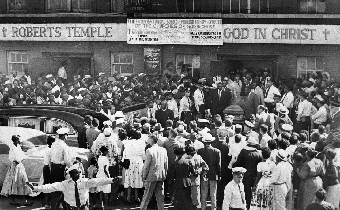 A crowd gathers outside the Roberts Temple Church of God In Christ in Chicago in September 1955 as pallbearers carry the casket of Emmett Till.