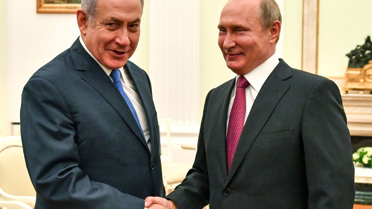 Russian President Vladimir Putin (R) shakes hands with Netanyahu during their meeting at the Kremlin in Moscow on July 11.