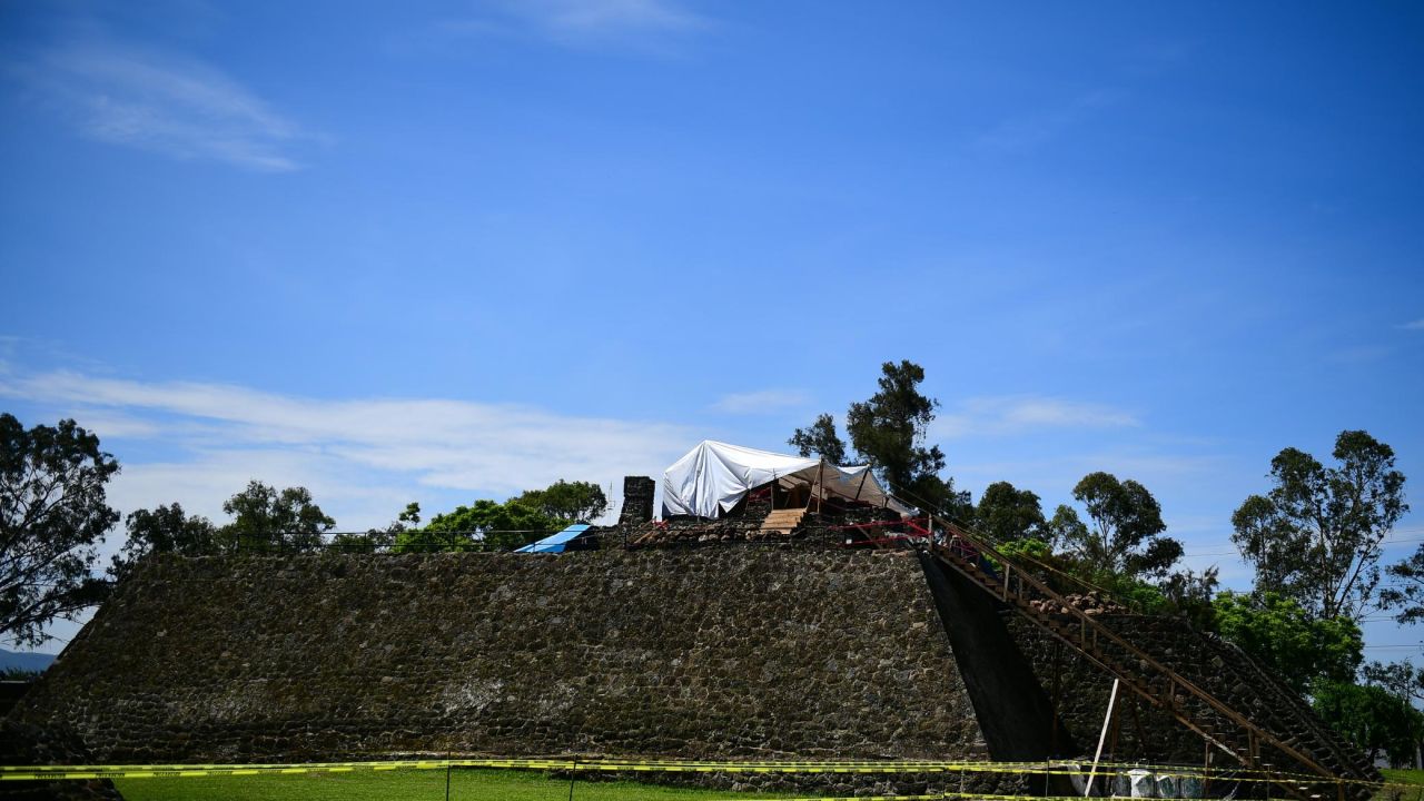 A team works on the top of the Teopanzolco pyramid in Morelos State, Mexico, on Wednesday. Damage caused by a 2017 earthquake revealed a substructure inside then pyramid.
