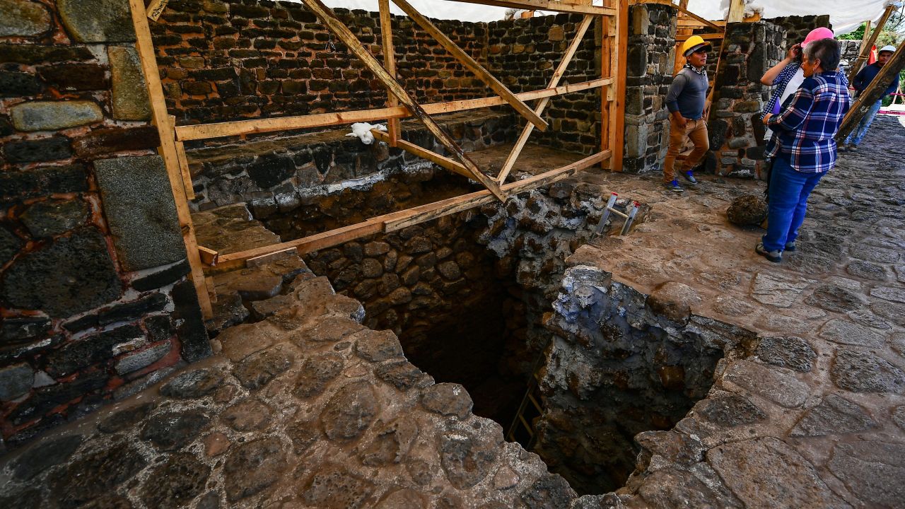 A team works on the newly revealed substructure Wednesday.
