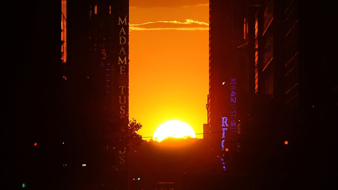 The sun sets on the horizon across 42nd Street. The effect only lasts a few minutes, so find a spot before sunset. 