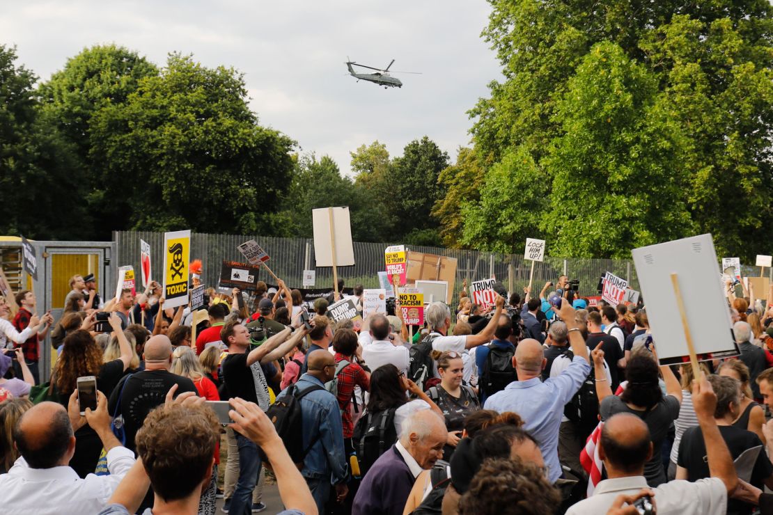 Protesters gathered as US President Donald Trump and First Lady Melania Trump leave in Marine One from the US ambassador's residence in London to Blenheim Palace on July 12, 2018.
