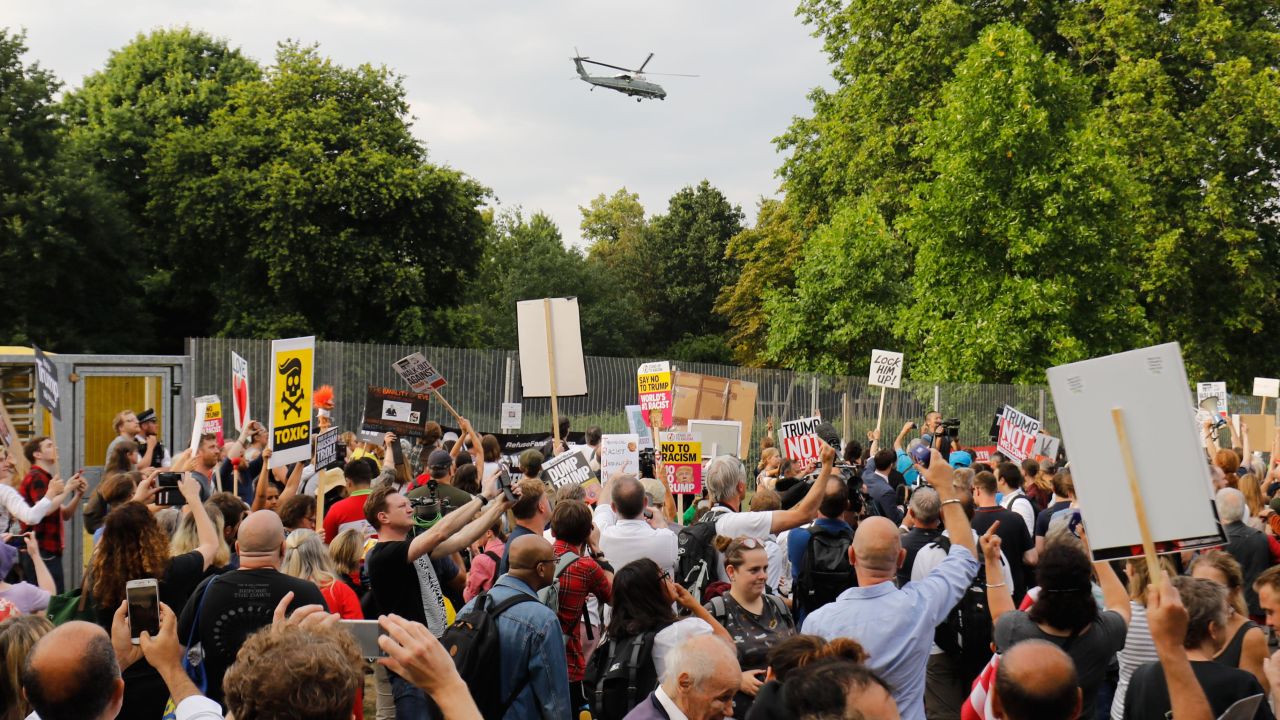 Protesters gathered as US President Donald Trump and First Lady Melania Trump leave in Marine One from the US ambassador's residence in London to Blenheim Palace on July 12, 2018.