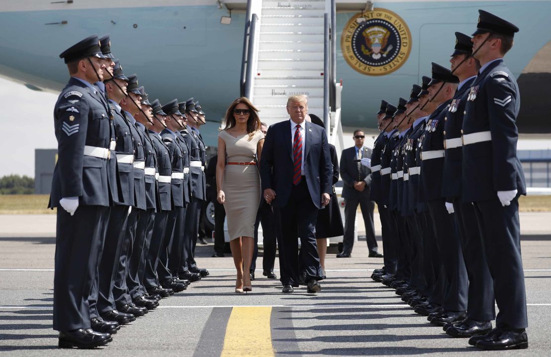 Donald Trump and first lady Melania Trump step off Air Force One as they arrive at London's Stansted airport.