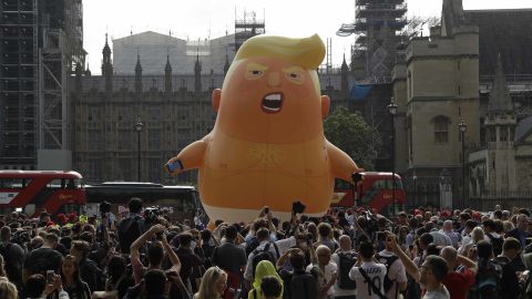 Crowds gather around the "Trump Baby" balloon.