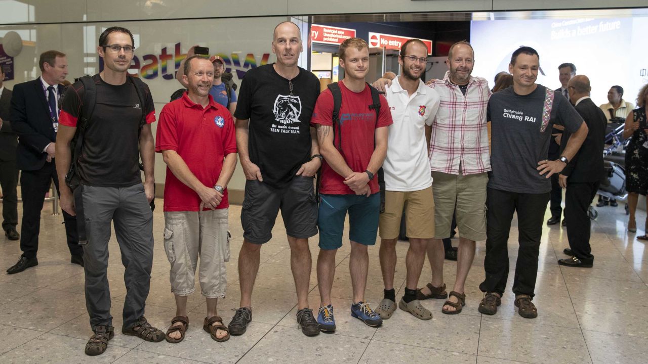 Divers and rescuers from the Thai cave mission arrive at Heathrow Airport Friday. From left to right: Chris Jewell, Mike Clayton, Rick Stanton, Lance-corporal Connor Roe, Josh Bratchley, Gary Mitchell and Jim Warny