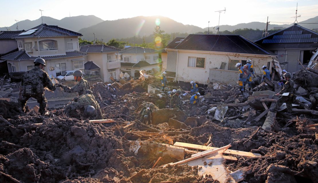 Japan Self-Defense Force members conduct search operations Wednesday in Kumano, Hiroshima.