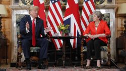 U.S. President Donald Trump, left, gestures while speaking during their meeting with with British Prime Minister Theresa May, right, at Chequers, in Buckinghamshire, England, Friday, July 13, 2018. (AP Photo/Pablo Martinez Monsivais)