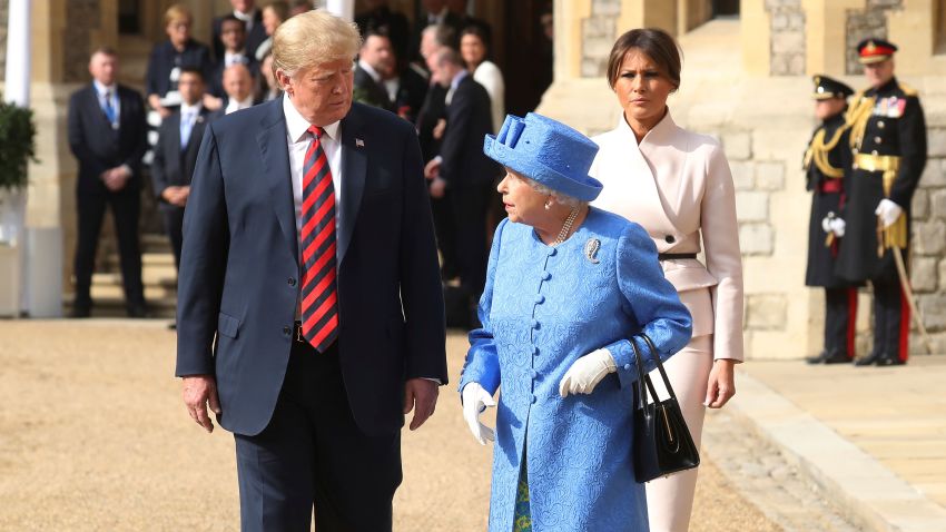Britain's Queen Elizabeth II, right, US President of the United States, Donald Trump and first lady Melania, background  walk from the Quadrangle after inspecting the Guard of Honour, during the president's visit to Windsor Castle, Friday, July 13, 2018 in Windsor, England. The monarch welcomed the American president in the courtyard of the royal castle. (Chris Jackson/Pool Photo via AP)