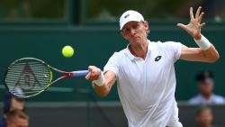 LONDON, ENGLAND - JULY 13: Kevin Anderson of South Africa returns against John Isner of The United States during their Men's Singles semi-final match on day eleven of the Wimbledon Lawn Tennis Championships at All England Lawn Tennis and Croquet Club on July 13, 2018 in London, England.  (Photo by Matthew Stockman/Getty Images)