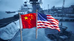 GFX trade war china usa flags shipping port