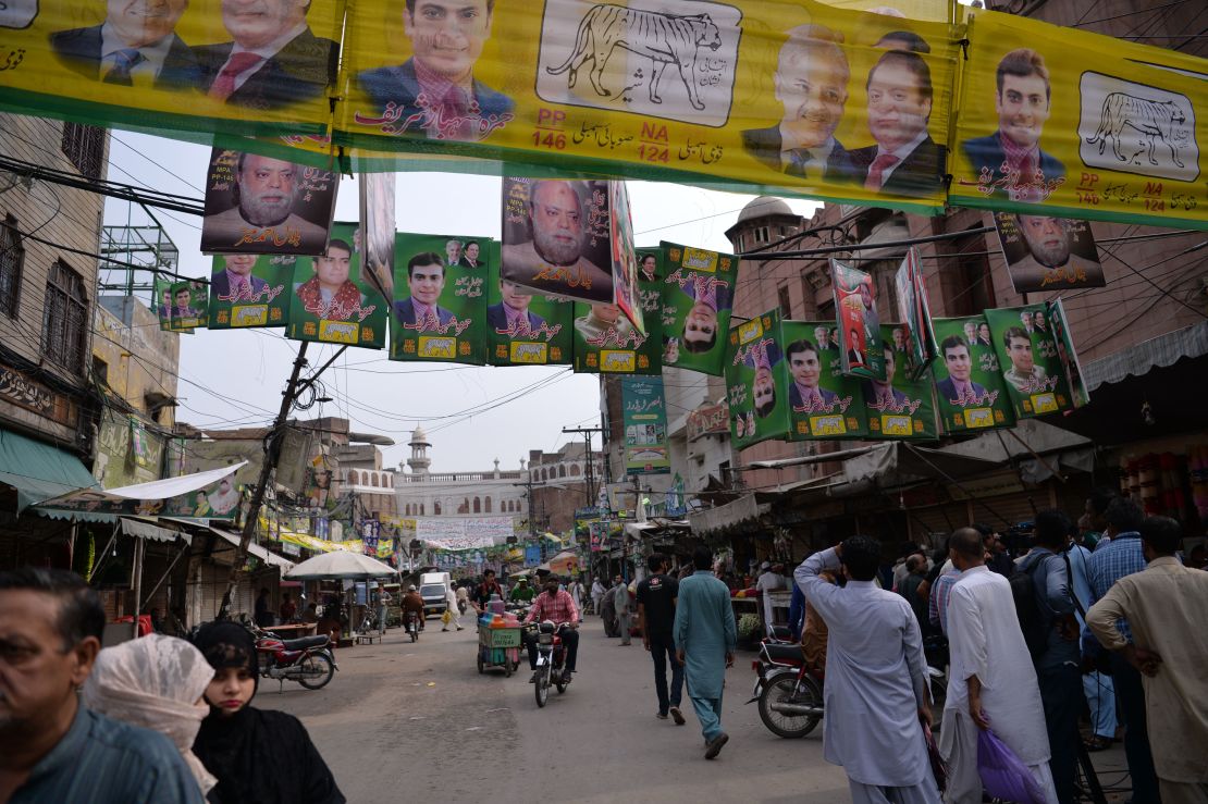 Supporters of Pakistan's ousted Prime Minister Nawaz Sharif and his younger brother Shahbaz Sharif gather at the venue where the younger Sharif would lead a rally.