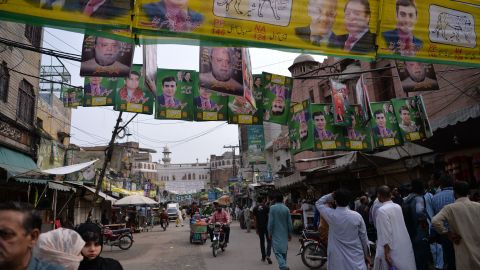 Supporters of Pakistan's ousted Prime Minister Nawaz Sharif and his younger brother Shahbaz Sharif gather at the venue where the younger Sharif would lead a rally.