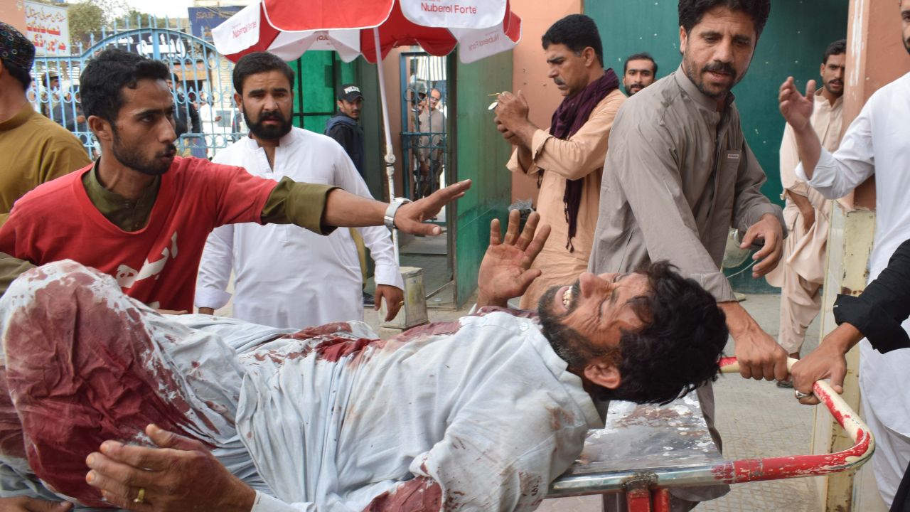 An injured Pakistani man is brought to a hospital in Quetta on Friday following the bomb blast.