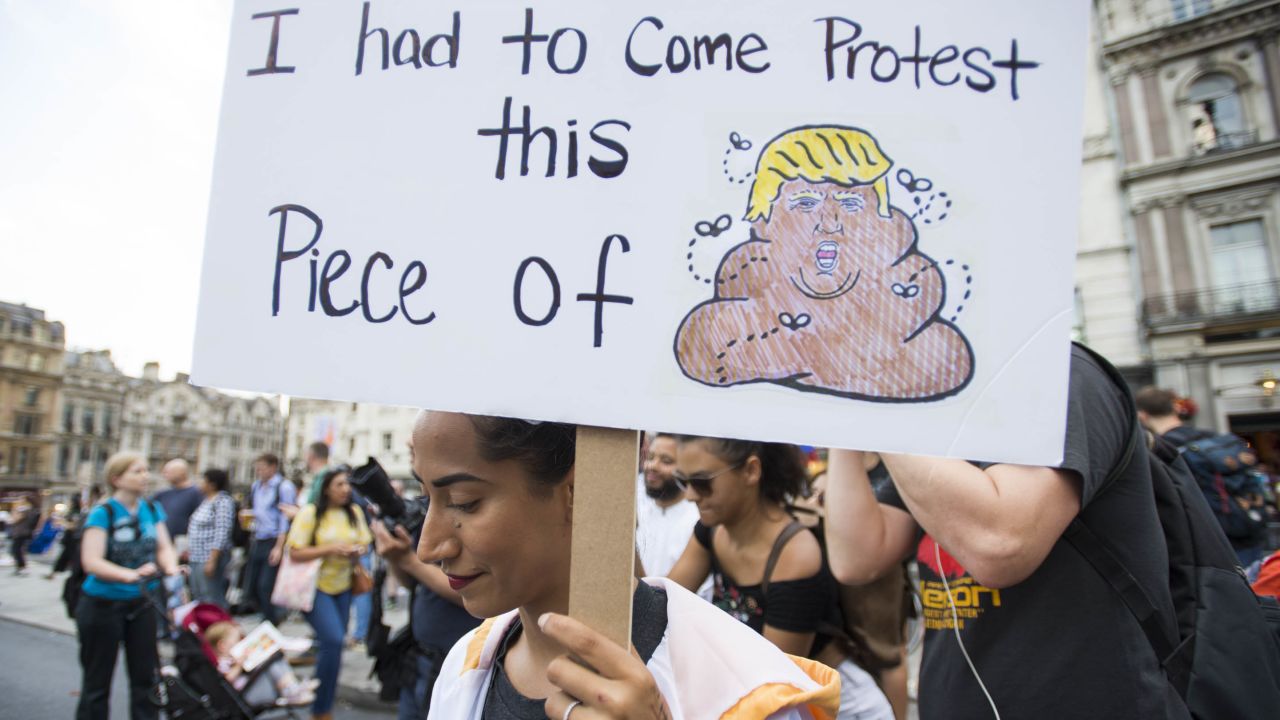 Mobashra Tazamal, from Washington, holds a placard in Trafagar Square.