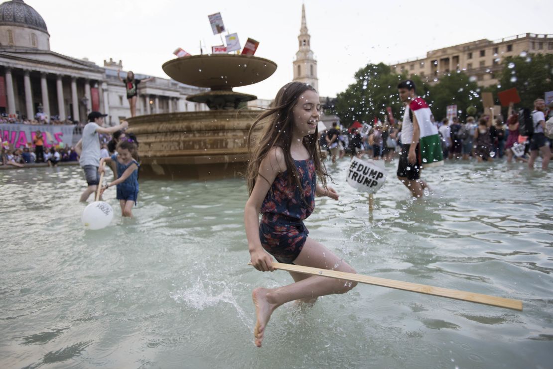 Aurora Haselfoot Flint celebrates her 10th birthday with a protest and splash in the Trafalgar Square fountain.