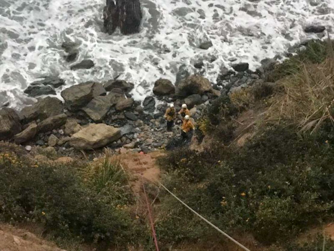 Emergency personnel used ropes to pull the woman up from the bottom of the cliff.