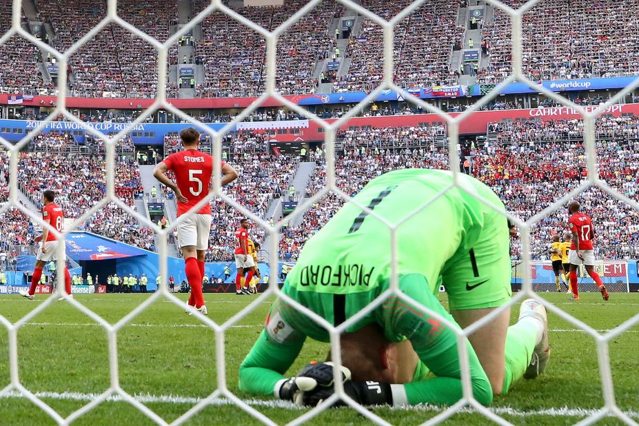 English goalkeeper Jordan Pickford reacts after the first goal against Belgium.