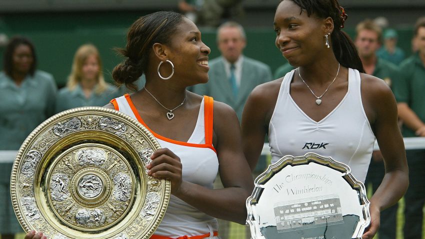 Serena Williams (L) of the US looks to her sister Venus Williams of the US after winning their Ladies Final match at the Wimbledon Tennis Championships 05 July, 2003 in Wimbledon, south London. Serena Williams won 4-6, 6-4, 6-2.   AFP PHOTO/Odd ANDERSEN  (Photo credit should read ODD ANDERSEN/AFP/Getty Images)