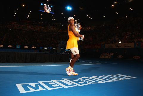 Serena poses with the Daphne Akhurst Trophy in 2010, her fifth Australian Open title. 