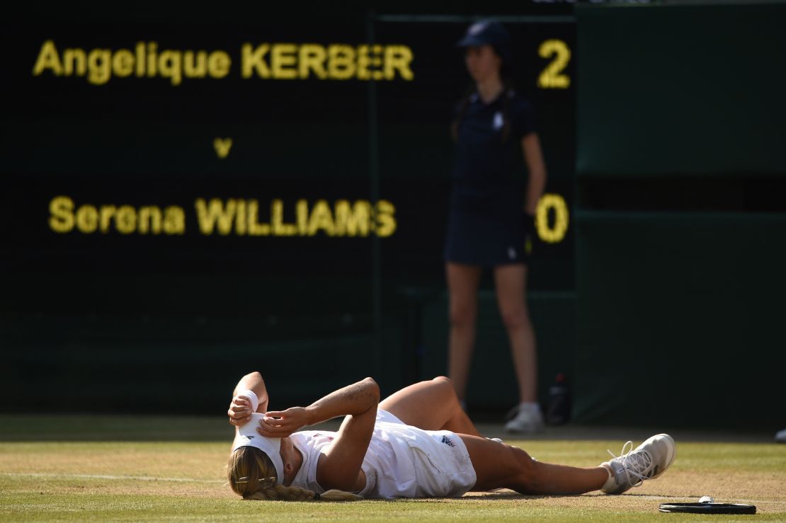 Kerber falls to the floor after her win