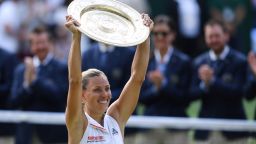 Germany's Angelique Kerber poses with the winner's trophy, the Venus Rosewater Dish, after her women's singles final victory over US player Serena Williams on the twelfth day of the 2018 Wimbledon Championships at The All England Lawn Tennis Club in Wimbledon, southwest London, on July 14, 2018. - Kerber won the match 6-3, 6-3. (Photo by Glyn KIRK / AFP) / RESTRICTED TO EDITORIAL USE        (Photo credit should read GLYN KIRK/AFP/Getty Images)