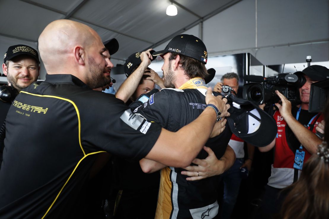 Jean-Eric Vergne celebrates with his Techeetah team after clinching the Formula E title in New York.