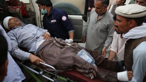 An injured man is put into an ambulance following a deadly attack in Kabul on Sunday.