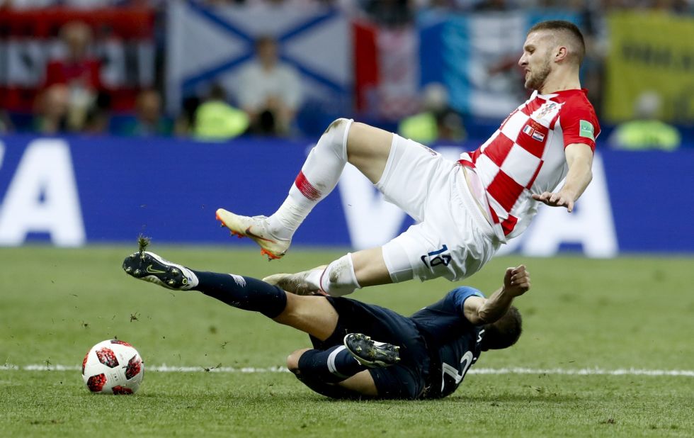 France's Lucas Hernandez tackles Ante Rebic.