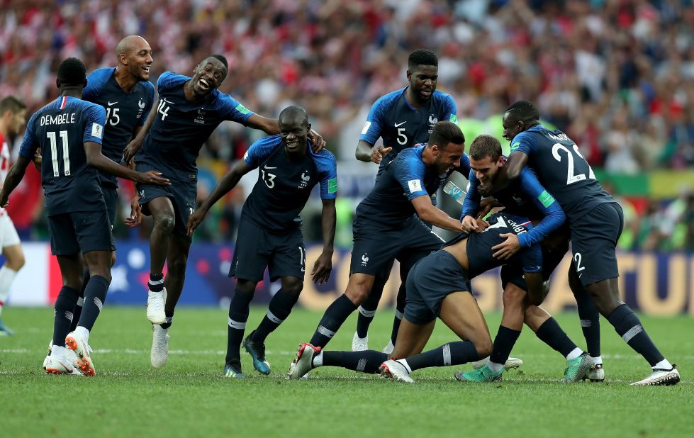 France mobs Kylian Mbappe after his goal gave the team a 4-1 lead.