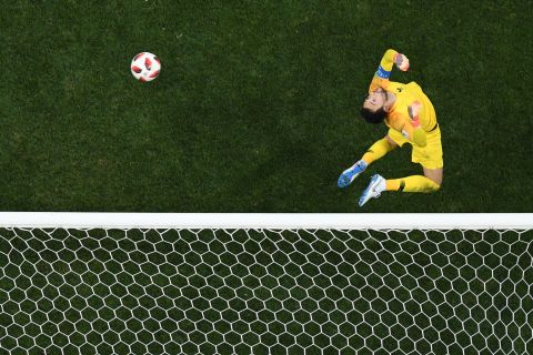 French goalkeeper Hugo Lloris makes a jumping save against Croatia.