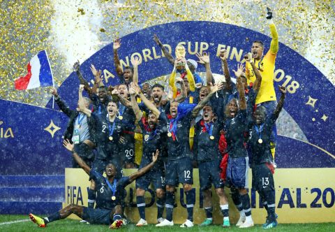 French players celebrate with the World Cup trophy after defeating Croatia in the final on Sunday, July 15.