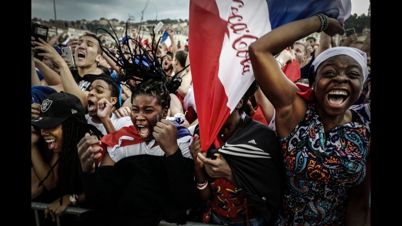 Fans react as they watch the World Cup final football match between France and Croatia, on Sunday, July 15, in Lyon. 