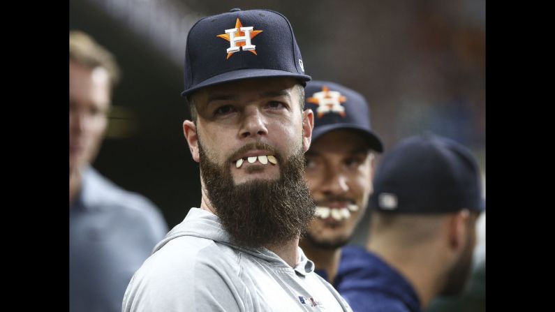 Houston Astros starting pitcher Dallas Keuchel holds seeds in his mouth while in the dugout during the game against the Oakland Athletics in Houston on Monday, July 9.