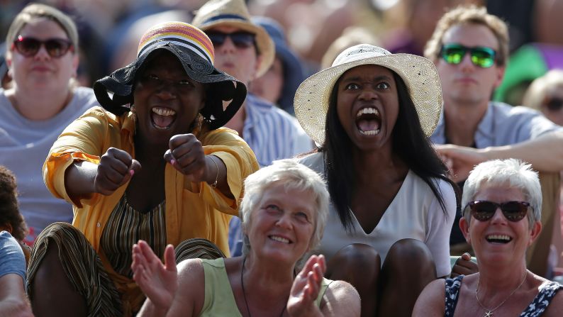 Spectators on Murray Mount react as Angelique Kerber plays against Serena Williams during their women's singles final match on Saturday, July 14.
