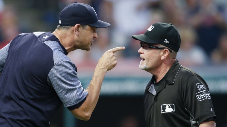 New York Yankees manager Aaron Boone, left, yells at umpire Jerry Meals after being ejected from a baseball game for arguing a strike-out by Giancarlo Stanton during the sixth inning of a baseball game against the Cleveland Indians, on Saturday, July 14, in Cleveland.