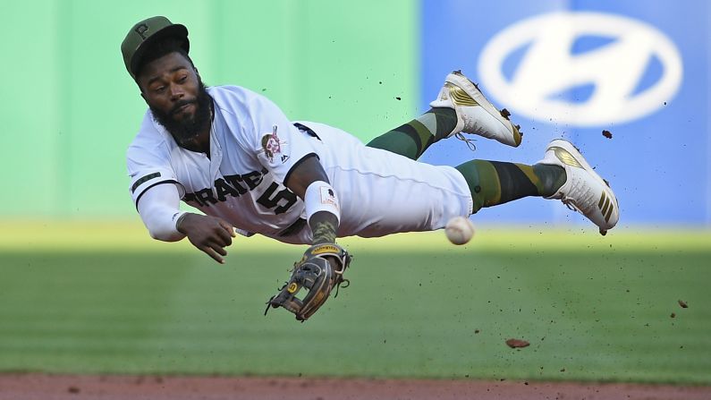 Josh Harrison of the Pittsburgh Pirates throws to first base in the second inning during the game against the Milwaukee Brewers on Thursday, July 12 in Pittsburgh.